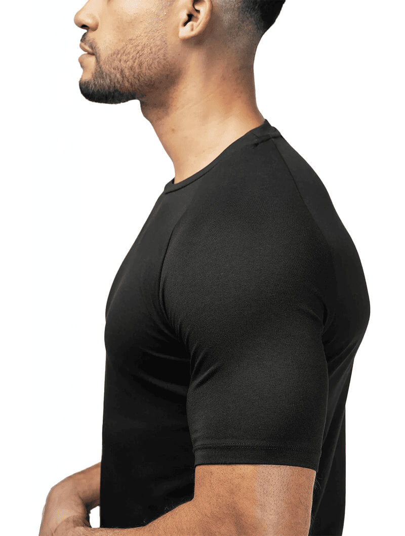 Man wearing a black t-shirt against a white background