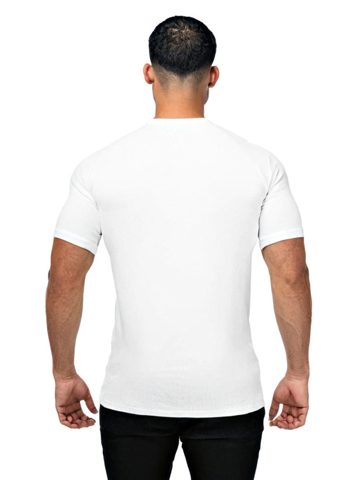 Man wearing a plain white t-shirt on a white background